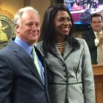 Gigi Edwards Bryant with State Senator Kirk Watson at the swearing in ceremony for new ACC board members (Photo courtesy of Senator Watson)